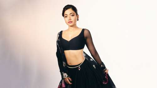 Indian actress Rashmika Mandanna wearing a traditional ethnic lehenga. wallpaper
