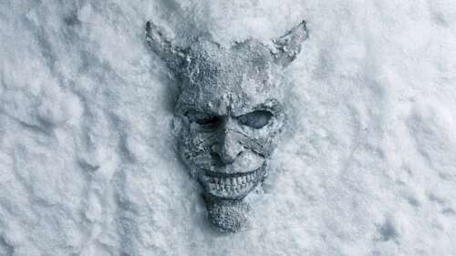A terrifying demonic entity covered in snow and ice, emerging from a dark, frozen... 4K (Ultra HD) desktop wallpaper
