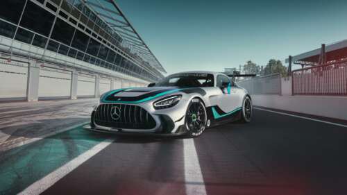 A 2025 Mercedes-AMG GT2 Edition W16 race car speeding through a curve on a professional... ps4 wallpaper