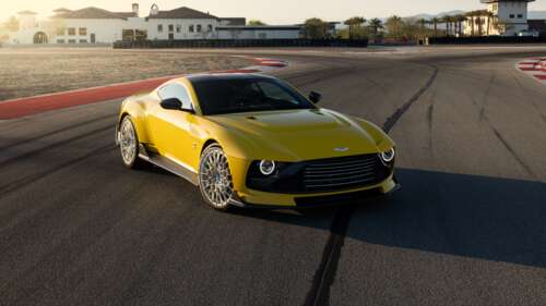 An Aston Martin Valour supercar driving at high speed on a professional race track. free wallpaper