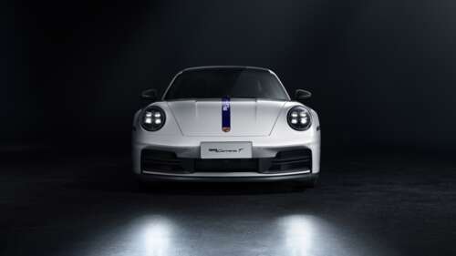 White Porsche 911 Carrera T with racing stripes on a dark background wallpaper