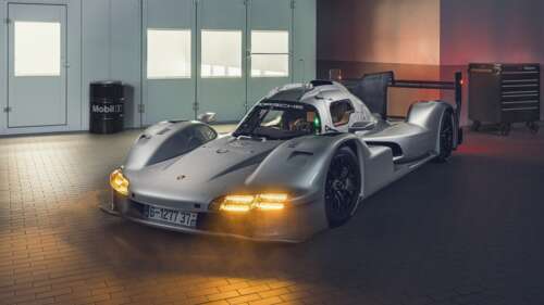 A close-up, high-detail shot of the Porsche 963 LMDh Prototype racing car. free wallpaper