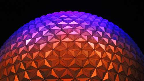 A vibrant purple geometric dome of Spaceship Earth at Walt Disney World, showcasing... wallpaper