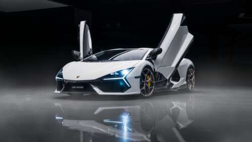 A white Lamborghini Revuelto supercar parked against a dark, minimalist background. computer backgrounds