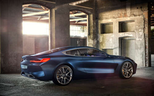 A sleek and futuristic BMW Concept 8 Series luxury car featuring aerodynamic lines... wallpaper