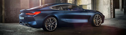 A sleek and futuristic BMW Concept 8 Series luxury car featuring aerodynamic lines... Dual UHD free desktop wallpaper