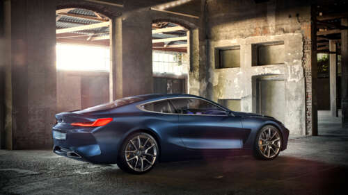 A sleek and futuristic BMW Concept 8 Series luxury car featuring aerodynamic lines... 8K wallpaper photo gallery download