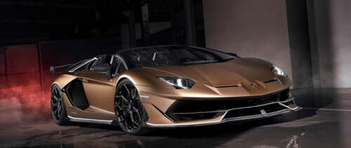 A luxurious brown Lamborghini Aventador SVJ supercar with a glossy finish. UWUHD hd background