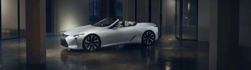 A sleek white Lexus LC 500 supercar captured in a high-quality automotive shot showing... Dual UHD high definition wallpaper