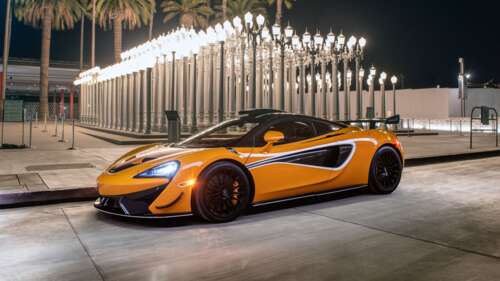 A sleek and vibrant orange McLaren 620R supercar highlighting its aerodynamic curves... 4K (Ultra HD) wallpaper images