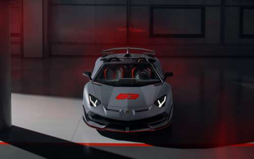 A sleek, metallic silver Lamborghini Aventador SVJ supercar featuring aggressive... 7680x4800 high definition wallpaper