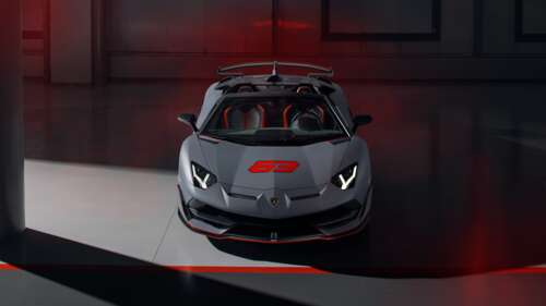 A sleek, metallic silver Lamborghini Aventador SVJ supercar featuring aggressive... 8K ps4 wallpaper