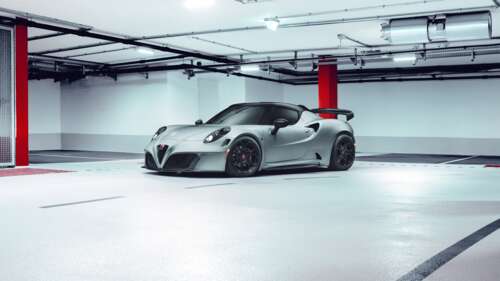 A close-up view of a sleek Alfa Romeo 4C sports car highlighting its aerodynamic... wallpaper