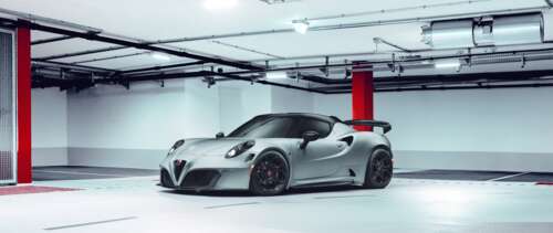A close-up view of a sleek Alfa Romeo 4C sports car highlighting its aerodynamic... UWUHD pictures for wallpaper