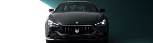 A high-end black Maserati Ghibli featuring a polished, sleek automotive design. wallpaper
