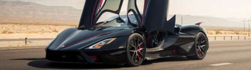 A sleek, black SSC Tuatara hypercar featuring a polished aerodynamic body. Dual UHD free hd wallpapers