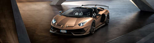 A luxury brown Lamborghini Aventador SVJ supercar featuring aerodynamic bodywork. wallpaper