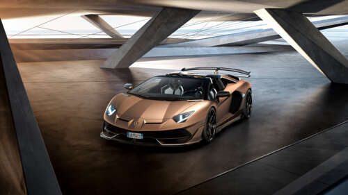 A luxury brown Lamborghini Aventador SVJ supercar featuring aerodynamic bodywork. 8K high definition wallpaper