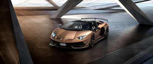 A luxury brown Lamborghini Aventador SVJ supercar featuring aerodynamic bodywork. UWUHD computer backgrounds