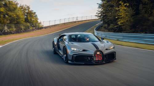 A detailed view of a Bugatti Chiron Pur Sport supercar featuring its iconic aerodynamic... 4K (Ultra HD) hd background