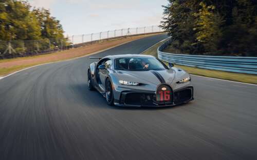 A detailed view of a Bugatti Chiron Pur Sport supercar featuring its iconic aerodynamic... 7680x4800 free desktop wallpaper