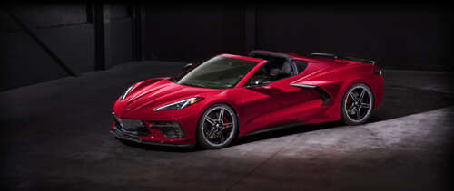 A high-performance Chevrolet Corvette C18 sports car showcasing its aerodynamic design. UWUHD free hd wallpapers