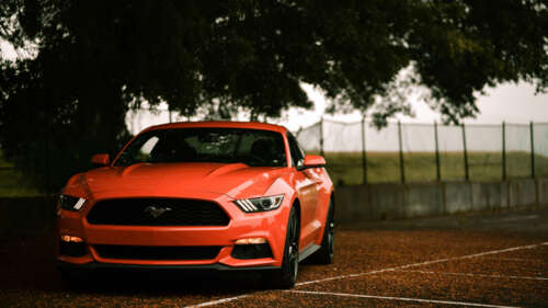 A classic Ford Mustang muscle car featuring its signature aggressive automotive design. 4K (Ultra HD)