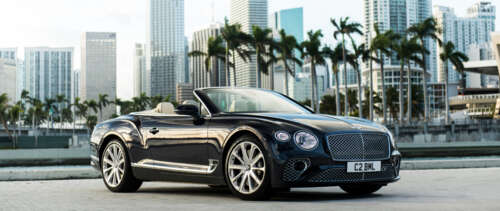 A premium black Bentley Continental GT Cabriolet featuring a glossy exterior and... wallpaper download