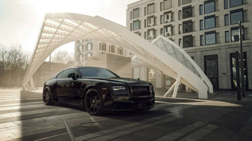 A luxurious black Rolls-Royce Wraith with a glossy finish and elegant automotive... 4K (Ultra HD) wallpaper for laptop download