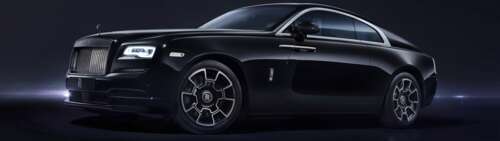 A luxurious black Rolls-Royce Wraith vehicle. Dual UHD