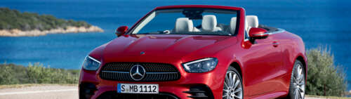 A luxury Mercedes-Benz E 450 Cabriolet convertible car in a professional setting. Dual UHD high definition wallpaper