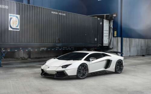 A high-performance white Lamborghini Aventador supercar with a polished finish. desktop wallpaper