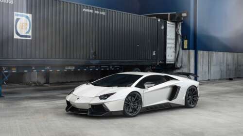 A high-performance white Lamborghini Aventador supercar with a polished finish. 8K free background