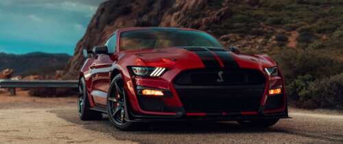 A high-performance Ford Mustang Shelby GT500 muscle car showcasing its muscular design... UWUHD wallpaper photo gallery download