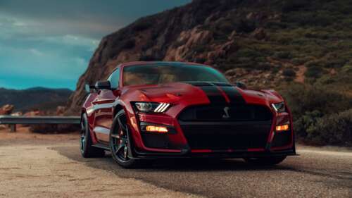 A high-performance Ford Mustang Shelby GT500 muscle car showcasing its muscular design... 8K free wallpaper for computer