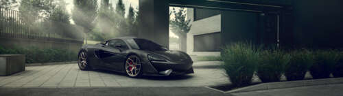A sleek, black McLaren 570S supercar with a glossy finish and aerodynamic design. wallpaper