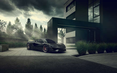 A sleek, black McLaren 570S supercar with a glossy finish and aerodynamic design. 7680x4800 high definition wallpaper