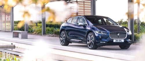 A sleek Jaguar I-Pace electric luxury SUV showcasing its modern design. UWUHD high definition wallpaper