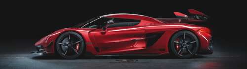 A high-performance Koenigsegg Jesko supercar featuring its iconic aerodynamic body... Dual UHD free background