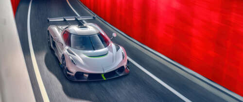 A sleek and powerful Koenigsegg Jesko hypercar in a high-detail shot. UWUHD high definition wallpaper