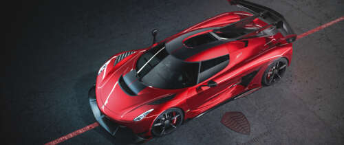 A stunning shot of a Koenigsegg Jesko supercar highlighting its sleek and aggressive... UWUHD free background