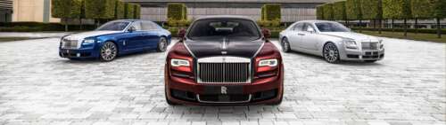 A high-end silver Rolls-Royce Ghost luxury sedan featuring a polished metallic finish. Dual UHD hd background