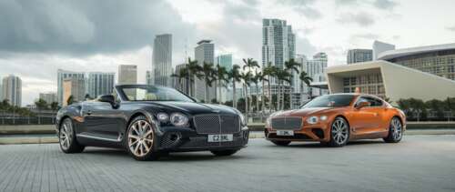 A luxury Bentley Continental GT convertible featuring a sleek black body with striking... free wallpaper