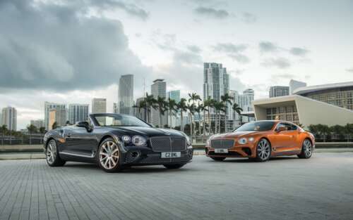 A luxury Bentley Continental GT convertible featuring a sleek black body with striking... 7680x4800 free wallpaper for computer