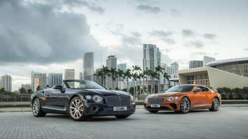 A luxury Bentley Continental GT convertible featuring a sleek black body with striking... 8K background images hd