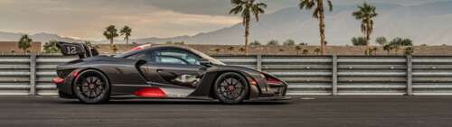 A detailed view of a McLaren Senna supercar featuring its aerodynamic body and aggressive... wallpaper download