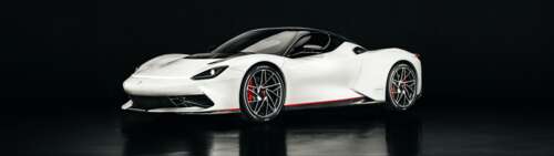 A sleek white Pininfarina Battista electric hypercar with aerodynamic curves. Dual UHD