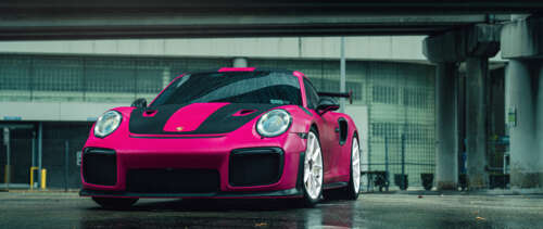A vibrant pink Porsche 911 GT2 RS luxury sports car UWUHD ps4 wallpaper