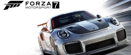 A high-performance Porsche racing car speeding through a corner on a professional... wallpaper