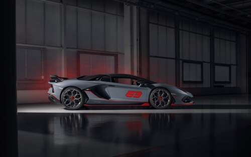 A sleek, metallic silver Lamborghini Aventador SVJ supercar showcasing its aerodynamic... 7680x4800 wallpaper for pc download